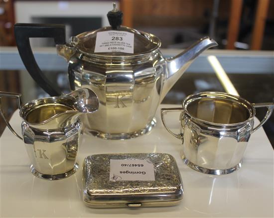 Three piece silver tea set and a cigarette case